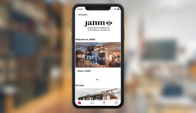 smartphone with screen showing bloomberg connects museum app